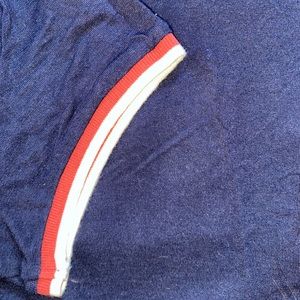 Red, white, and blue t-shirt.